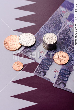 Qatar paper money, the Qatari riyal as a tool for financial transactions and trade. Qatari money Qatar paper money, the Qatari riyal as a tool for financial transactions and trade. Qatari money 140049127
