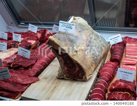 New york, usa august 20,2024. Dry aged ribeye and premium raw beef cuts displayed in a butcher shop showcase at chelsea market, manhattan, nyc 140049188