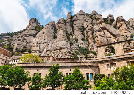 Montserrat mountain rock formations and monastery architecture in Catalonia Spain Montserrat mountain rock formations and monastery architecture in Catalonia Spain 140049202