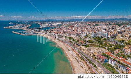 Aerial panoramic view of Tarragona coastline with Roman amphitheater and Mediterranean harbor in Spain 140049218