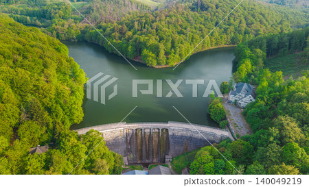 Aerial view of Glortalsperre dam surrounded by forest landscape in Sauerland near Altena Germany Aerial view of Glortalsperre dam surrounded by forest landscape in Sauerland near Altena Germany 140049219