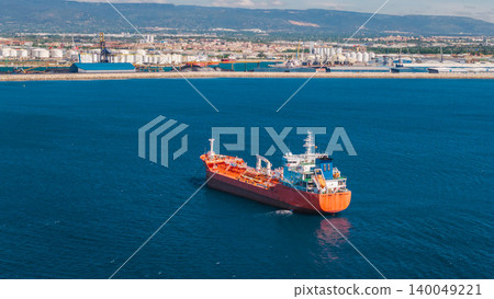 Aerial view of chemical tanker ship near industrial port coastline in Tarragona Spain Aerial view of chemical tanker ship near industrial port coastline in Tarragona Spain 140049221