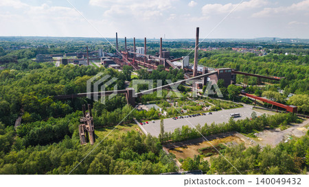 Aerial panorama of historic Zollverein industrial complex in Essen surrounded by green urban landscape in Germany 140049432