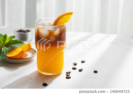 Cold bumble coffee with orange juice and ice 140049725