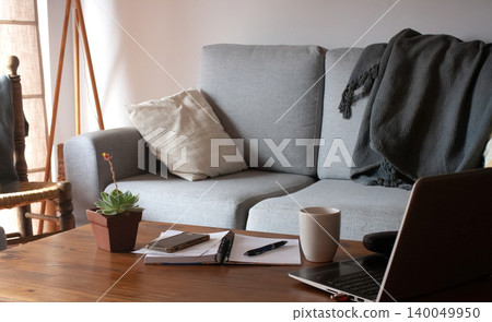 Virtual work items and electronic devices on a livingroom table. 140049950