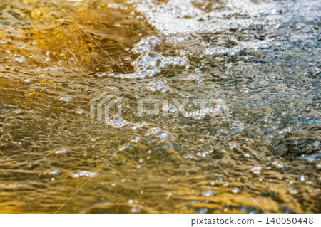 Close-up of a frothy, clear stream 03 Close-up of a frothy, clear stream 03 140050448