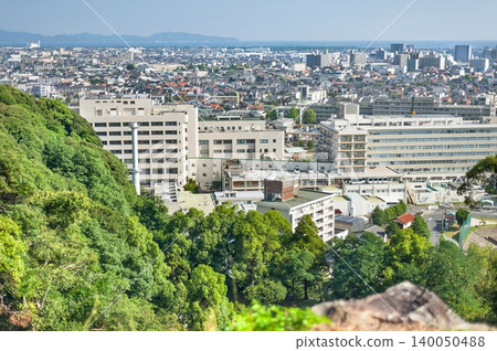 A panoramic view of Tottori University Hospital and the city of Yonago from the mountaintop of the Yonago Castle ruins (Yonago City, Tottori Prefecture). A panoramic view of Tottori University Hospital and the city of Yonago from the mountaintop of the Yonago Castle ruins (Yonago City, Tottori Prefecture). 140050488