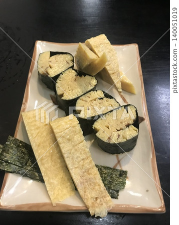 Thick omelet wrapped in seaweed and rolled omelet with dashi broth - appetizers at a sushi restaurant Thick omelet wrapped in seaweed and rolled omelet with dashi broth - appetizers at a sushi restaurant 140051019