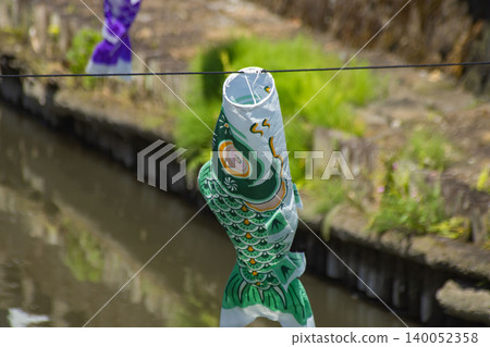 A carp streamer with a spiral pattern sways in the wind. A carp streamer with a spiral pattern sways in the wind. 140052358