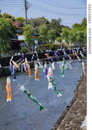 A carp streamer with a spiral pattern sways in the wind. A carp streamer with a spiral pattern sways in the wind. 140052454