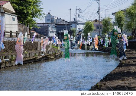 A carp streamer with a spiral pattern sways in the wind. A carp streamer with a spiral pattern sways in the wind. 140052470