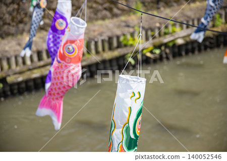 A carp streamer with a spiral pattern sways in the wind. A carp streamer with a spiral pattern sways in the wind. 140052546
