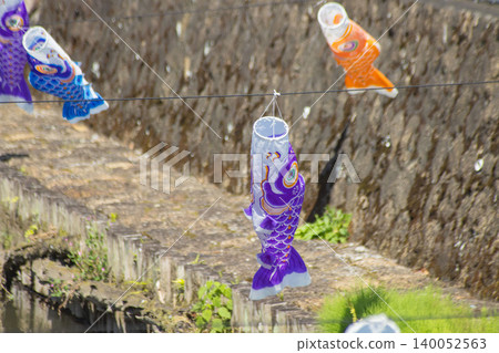 A carp streamer with a spiral pattern sways in the wind. A carp streamer with a spiral pattern sways in the wind. 140052563
