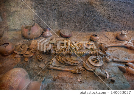 Human skeleton with ancient jewelry or clothing and food containers at the Ban Non civilization site, a temple that is more than 4,000 years old, Non Sung, Nakhon Ratchasima Thailand. Human skeleton with ancient jewelry or clothing and food containers at the Ban Non civilization site, a temple that is more than 4,000 years old, Non Sung, Nakhon Ratchasima Thailand. 140053037