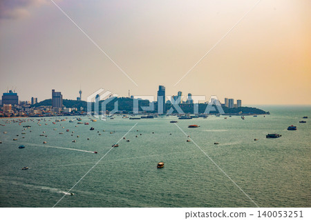 Pattaya city from high angle with beach and buildings in morning time. It is a landmark and popular tourist destination. Pattaya city from high angle with beach and buildings in morning time. It is a landmark and popular tourist destination. 140053251