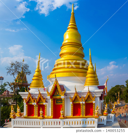 The beautiful golden pagoda is a masterpiece of traditional Thai temple art, set against a background of the sky. The beautiful golden pagoda is a masterpiece of traditional Thai temple art, set against a background of the sky. 140053255