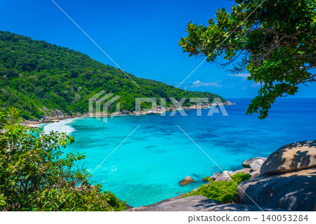Beautiful view point with blue sky and clouds, blue sea and white sand beach on Similan island, No.8 at Similan national park, Phuket, Thailand is most popular vacation for tourist. Beautiful view point with blue sky and clouds, blue sea and white sand beach on Similan island, No.8 at Similan national park, Phuket, Thailand is most popular vacation for tourist. 140053284