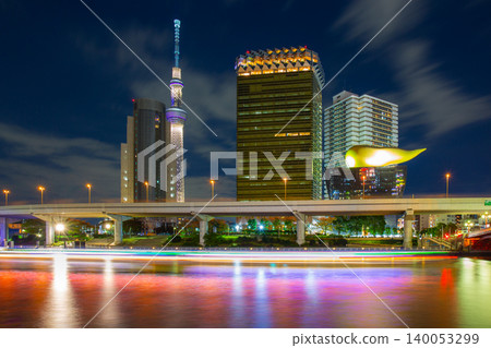 The buildings in the Asakusa area, which are landmarks located along the Sumida River, are visible at night. The buildings in the Asakusa area, which are landmarks located along the Sumida River, are visible at night. 140053299