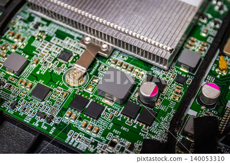 Close Up of Chips on boards of computer and smart devices or laptop notebook Processing phone with heat sink. Select focus and Copy space background Close Up of Chips on boards of computer and smart devices or laptop notebook Processing phone with heat sink. Select focus and Copy space background 140053310