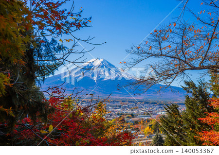 Mount Fuji with trees in the foreground in autumn in Kawaguchiko, Yamanashi, Japan. 140053367