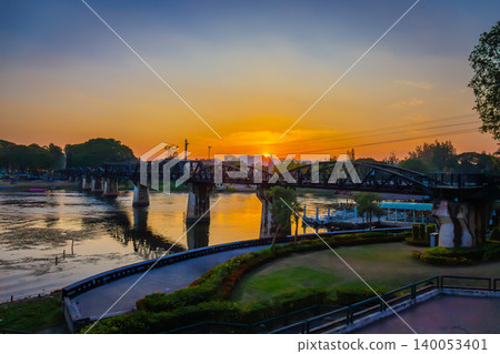 Landscape of Bridge River Kwai at Kanchanaburi, Thailand in sunset time. Is a famous place and a tourist destination Landscape of Bridge River Kwai at Kanchanaburi, Thailand in sunset time. Is a famous place and a tourist destination 140053401