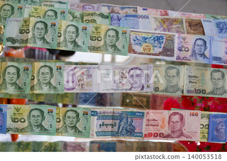 collection of banknotes in various ASEAN currencies stapled together. collection of banknotes in various ASEAN currencies stapled together. 140053518