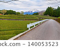 Road passes through Tea plantation with Mount Fuji in the background is a famous landmark of Shizuoka City, Japan on a rainy and cloudy day. 140053523