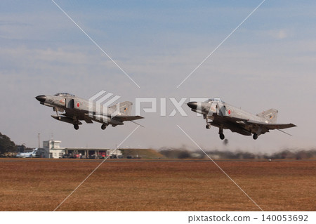 Japan Air Self-Defense Force F-4EJ Kai Phantom II fighter jets taking off in formation. Japan Air Self-Defense Force F-4EJ Kai Phantom II fighter jets taking off in formation. 140053692