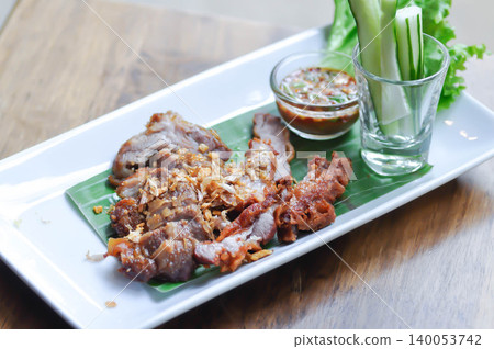 fried pork with fried garlic , fried pork or sliced pork with dip or chili sauce fried pork with fried garlic , fried pork or sliced pork with dip or chili sauce 140053742