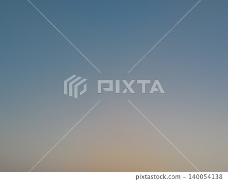 Minimalist morning background texture features a smooth gradient sky layout. A soft orange sunrise glow transitions beautifully into calm blue tones, offering clean copy space. Minimalist morning background texture features a smooth gradient sky layout. A soft orange sunrise glow transitions beautifully into calm blue tones, offering clean copy space. 140054138