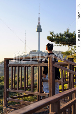 Korean young man sightsee N Seoul tower at sunset, Korea Korean young man sightsee N Seoul tower at sunset, Korea 140054420