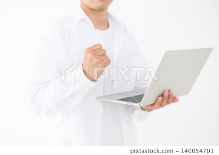 Portrait of a middle-aged man holding a laptop and striking a triumphant pose against a white background. Portrait of a middle-aged man holding a laptop and striking a triumphant pose against a white background. 140054701