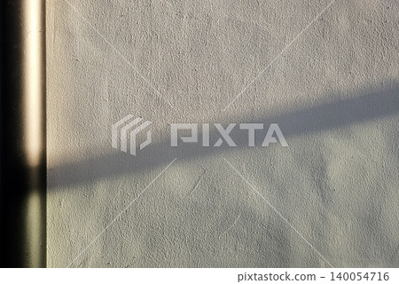 Concrete Wall Background with Sun Rays Creating a Distinct Shadow. Concrete Wall Background with Sun Rays Creating a Distinct Shadow. 140054716