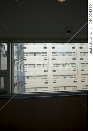 The cityscape of Seoul unfolds beyond the window, with modern architecture and the reflection of light. The cityscape of Seoul unfolds beyond the window, with modern architecture and the reflection of light. 140054850