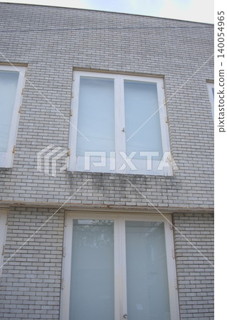 A simple and beautiful modern window with white brick walls and frosted glass. A simple and beautiful modern window with white brick walls and frosted glass. 140054965