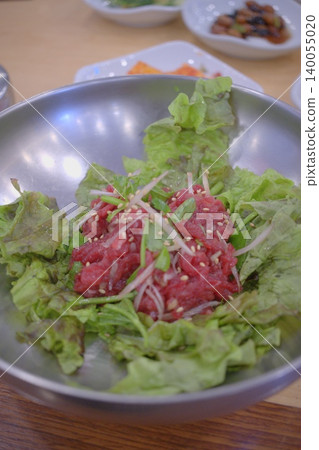 Authentic Seoul-style yukhoe (Korean beef tartare) with vibrant, fresh colors. 140055020