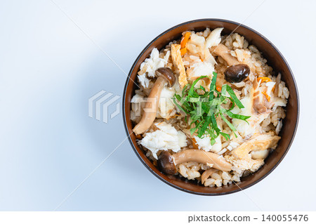 Photo of Japanese-style mixed rice with sea bream, mushrooms, and perilla leaves. 140055476