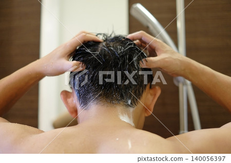 Men taking a shower Men taking a shower 140056397