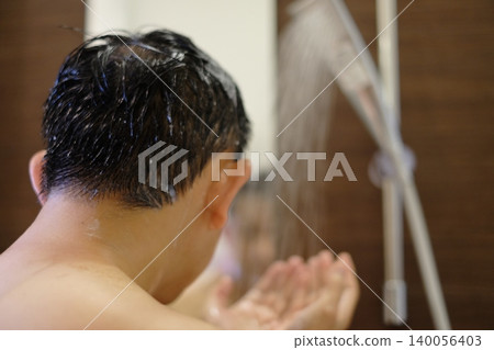 Men taking a shower Men taking a shower 140056403