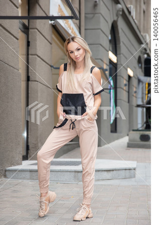 Lovely woman dressed in sports suit Lovely woman dressed in sports suit 140056465