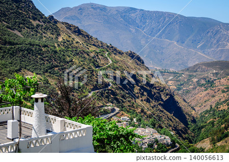 Picturesque view of a village Pampaneira located on a mountainside in the Sierra Nevada region of Spain 140056613