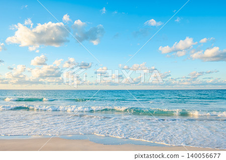 Serene ocean waves gently lapping the sandy beach. Serene ocean waves gently lapping the sandy beach. 140056677