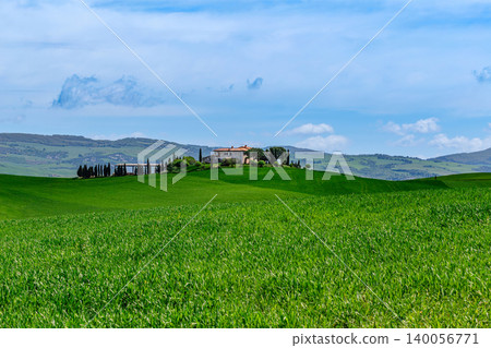 Rolling green hills with a rustic farmhouse, Tuscany, Italy. Rolling green hills with a rustic farmhouse, Tuscany, Italy. 140056771