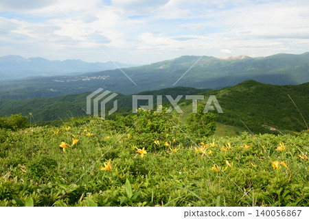 A view of Kusatsu from the western ridge of Lake Nozori, where daylilies are in full bloom. A view of Kusatsu from the western ridge of Lake Nozori, where daylilies are in full bloom. 140056867