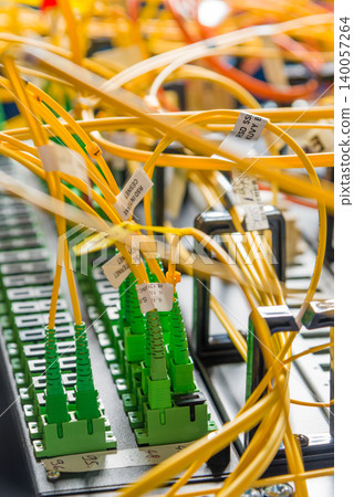 detail of server rack with fiber optic cables attached to front 140057264