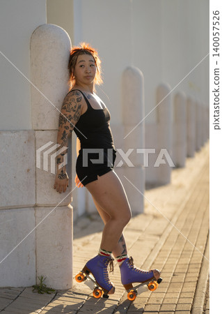 Young woman roller skating urban outdoor lifestyle portrait 140057526