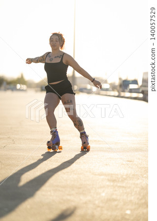 Woman roller skating balancing with outstretched arms Woman roller skating balancing with outstretched arms 140057529