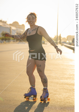 Young woman enjoying roller skating at sunset Young woman enjoying roller skating at sunset 140057632