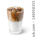 Iced latte coffee drink in transparent glass with condensation isolated on white background. File contains clipping path 140058355