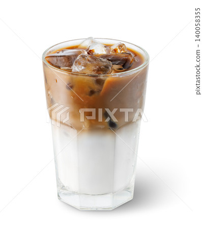 Iced latte coffee drink in transparent glass with condensation isolated on white background. File contains clipping path Iced latte coffee drink in transparent glass with condensation isolated on white background. File contains clipping path 140058355